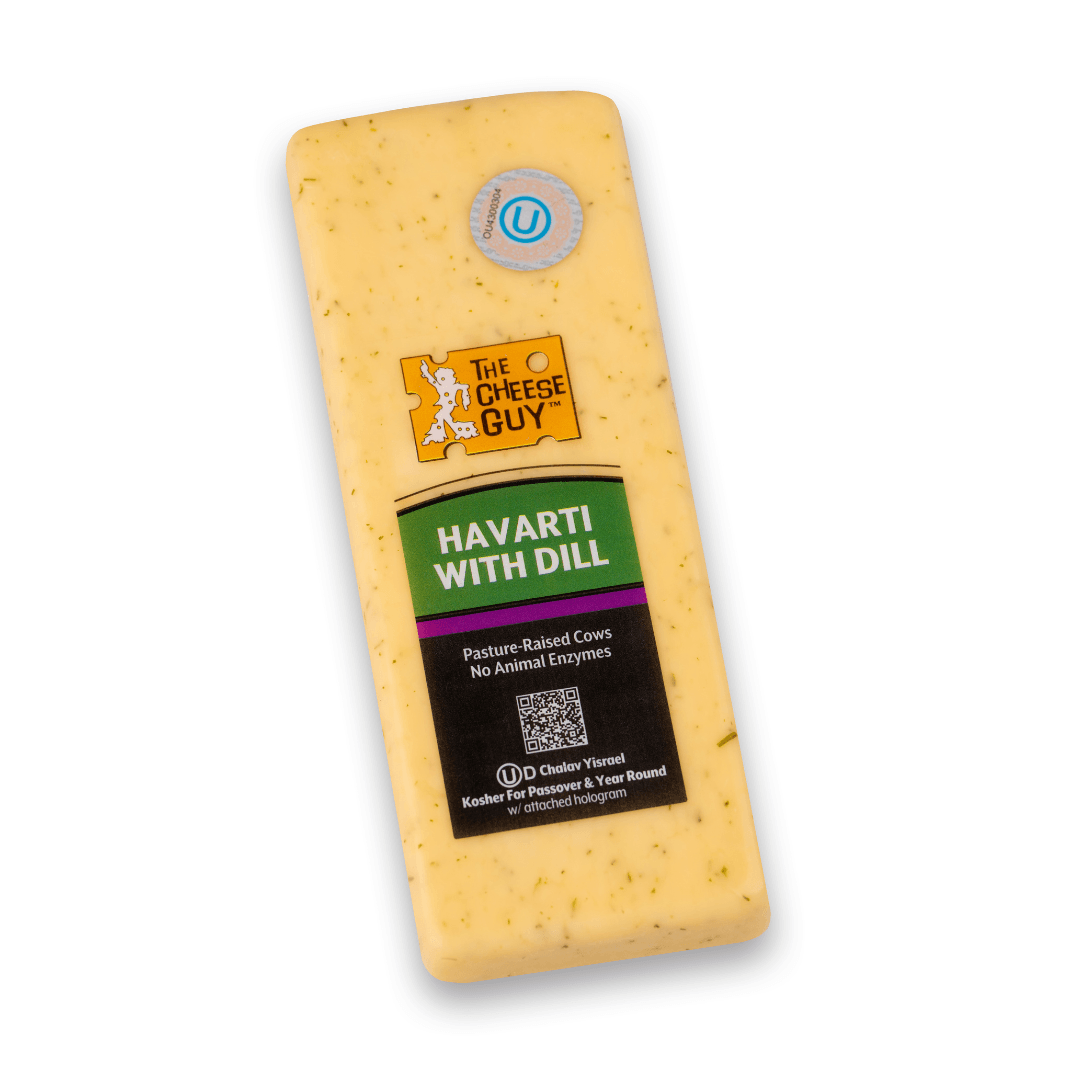 Image of The Cheese Guy Havarti with Dill, a light yellow cheese with visible dill flecks, in a rectangular block, showing the brand logo and product information on the label.