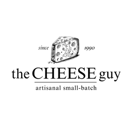 The Cheese Guy logo features the words 'the CHEESE guy' in a stylized serif font, with the tagline 'artisanal small-batch' below. A cheese wedge graphic is positioned above the text. The logo is dark gray on a transparent background.