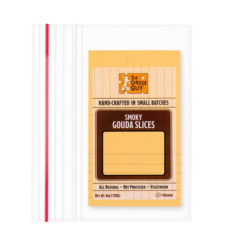 Image of The Cheese Guy Smoky Gouda Slices, in a white plastic bag with red stripes, showing the brand logo, 'Smoky Gouda Slices' product name, and attributes like 'All Natural' and 'Vegetarian'.
