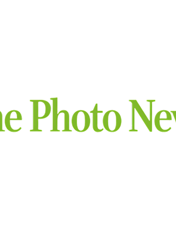 The Photo News logo: Lime green, italicized serif text on a transparent background